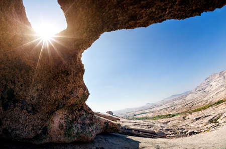 Cave in the Desert Mountains with sun at the hot day in eastern Kazakhstanの写真素材
