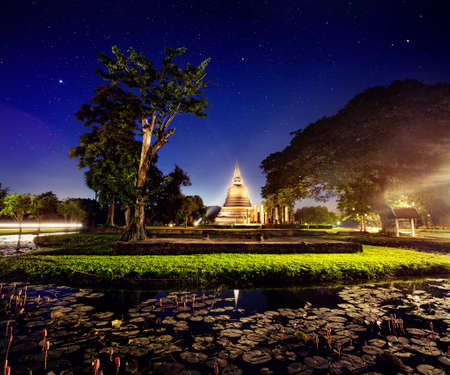 Light show in Golden Stupa Buddhist Temple in Sukhothai Historical Park, Thailand