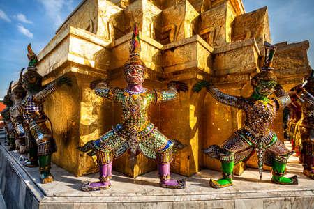 Demon golden statues support pyramid at Wat Phra Kaew in Grand Palace in Bangkok, Thailand