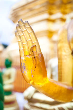 Hand of Buddha in mudra from yellow stone in Wat Doi Suthep, Ciang Mai, Thailandの写真素材