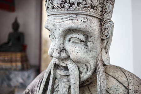 Stone statue of monk in Buddhist Temple Wat Pho in Bangkok, Thailandの写真素材