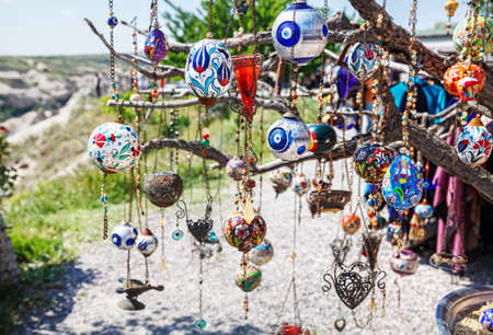 Evil eyes and balloons on the tree in Goreme Panorama Cappadocia, Turkeyの写真素材