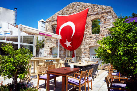 Restaurant with Red Turkish flag near Greek Ruins in Bodrum, Turkeyの写真素材