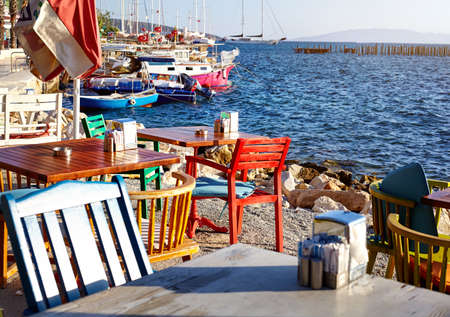 Colorful chairs and tables in seaside restaurant of Bodrum, Turkeyの写真素材