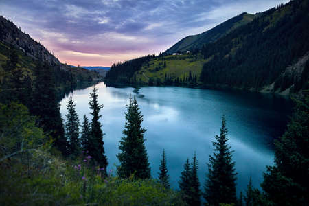 Beautiful view of high mountain lake Kolsai at sunset in Kazakhstan, central Asiaの写真素材