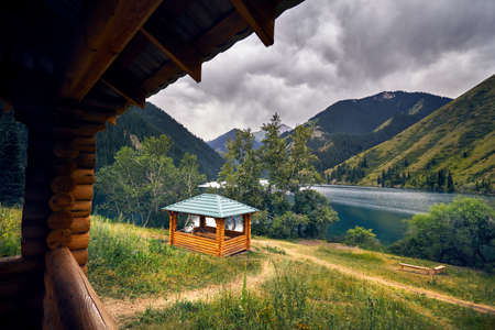 Beautiful view of resting house in the mountain lake Kolsai in Kazakhstanの写真素材
