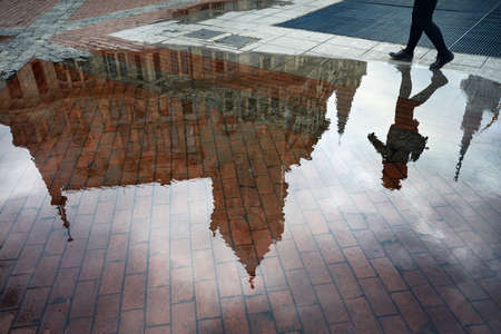 Woman reflection in puddle at Europe Square in Batumiのeditorial素材
