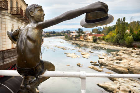 Sculpture of Boy with hat on the bridge in the central Kutaisi, Georgiaの写真素材
