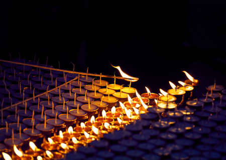 Monk fire the oil lamps of peace in the Buddhist Temple in Kathmanduの写真素材