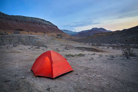 Touristic orange tent in the Desert mountains at sunrise in Kazakhstanの写真素材