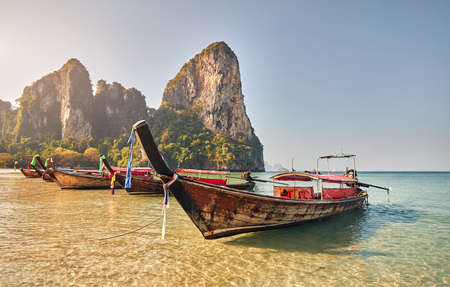 Long tail boats on tropical island at Krabi province, Thailandの写真素材