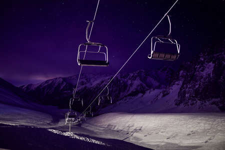 Cable car station at the mountain with starry night sky in Shymbulak ski resort in Almaty, Kazakhstanの写真素材