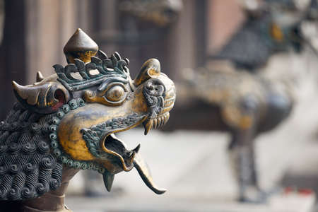 Old statue of dragon in Buddhist temple of Kathmandu, Nepalの写真素材
