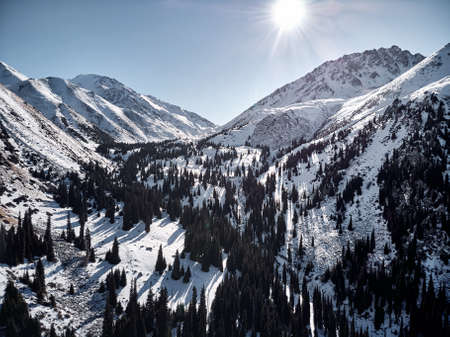 Aerial view of the winter mountain landscape in sunny day at Almarasan gorge in Almaty, Kazakhstan.の写真素材