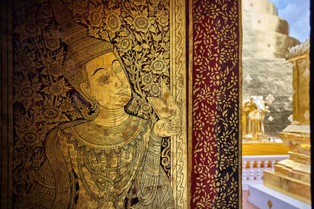 Golden Buddha painting on the wall of Wat Doi Suthep temple in Ciang Mai, Thailandの写真素材
