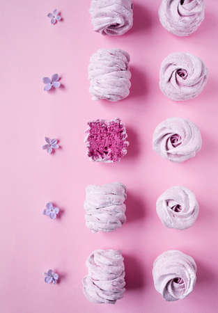 Violet sweet homemade Zephyr or Marshmallow from black currant and lilac flowers on pink bright...