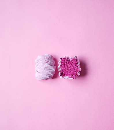 Minimalism art with cut Violet sweet homemade Zephyr or Marshmallow from black currant on pink bright background top viewの写真素材
