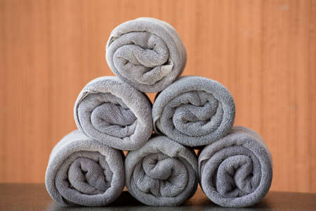 Rolled up grey spa towelsの写真素材