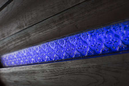 Wood wall with stainglass