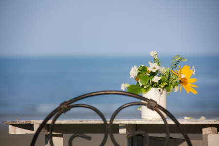 Flower vase with sea background の写真素材