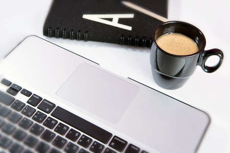 Laptop  notebook  with cup of coffee and notepad