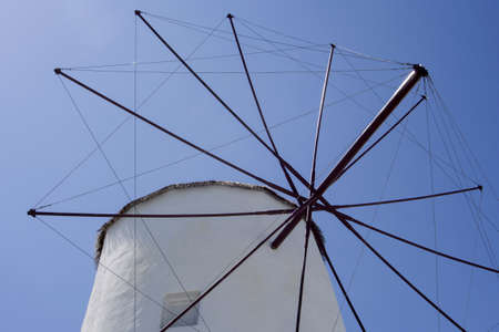 Vintage windmill against blue skyの写真素材