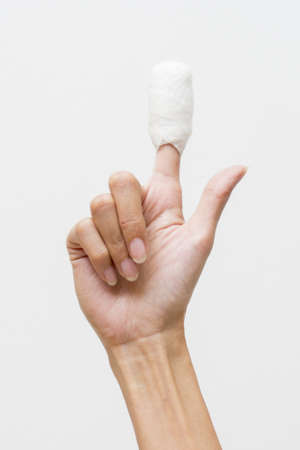 White medicine bandage on human injury hand fingerの写真素材