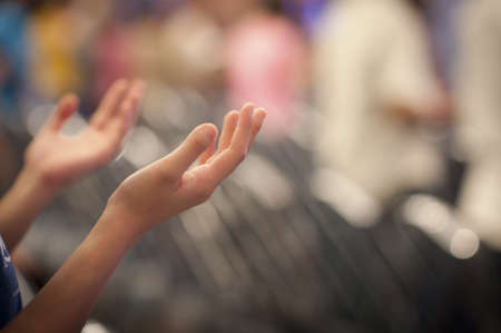 Hands raised like praying or worshiping Hands raised like praying or worshiping