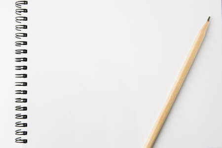 Notebook and pencils on white backgroundの写真素材