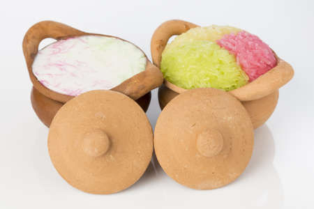 Colorful sticky rice and sweet-noddles in coconut milk, Thai dessert in clay pottery ceramicの写真素材