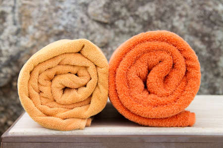 Rolled up orange spa towelsの写真素材