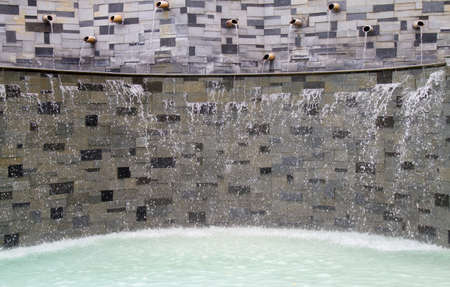 Outdoorswimming pool with waterfall