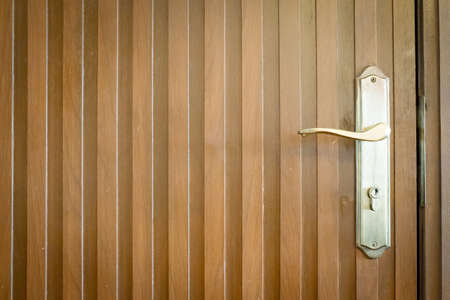 Door knob on wooden doorの写真素材