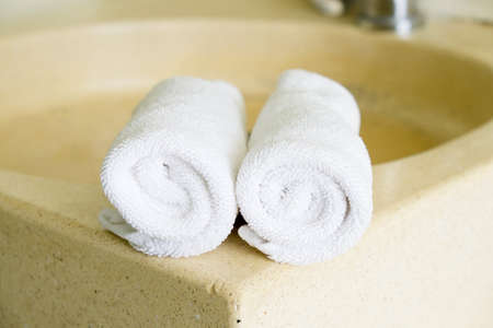 Stacked white spa towelsの写真素材