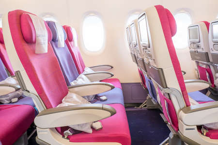 seat rows in an airplane cabinの写真素材
