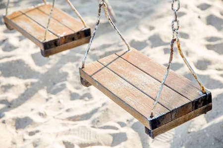 Wooden swing with ropes