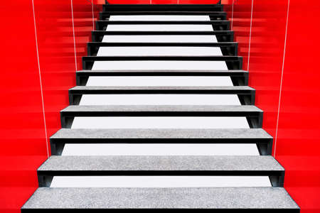 Modern white stairs with wooden handrail