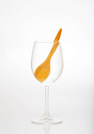 Example of the water refraction with a glassand wooden spoonの写真素材