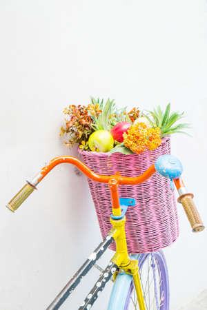 Vintage bicycle with a basket of flowersの写真素材