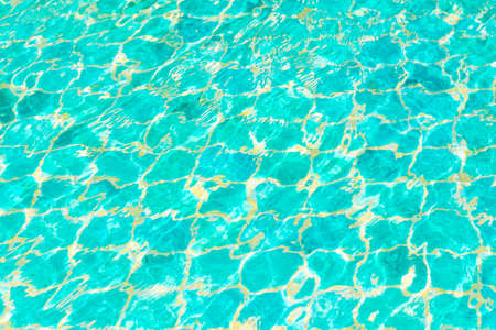 Hotel swimming pool with sunny reflections