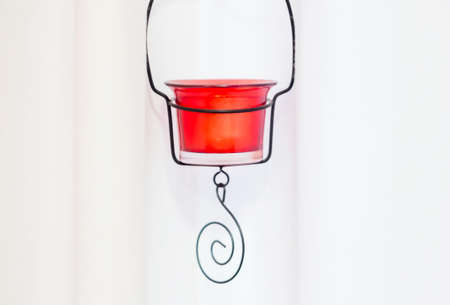 red candle holder on white backgroundの写真素材