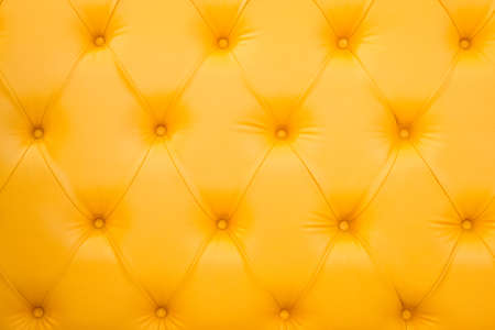 Closeup texture of vintage brown leather sofa for backgroundの写真素材