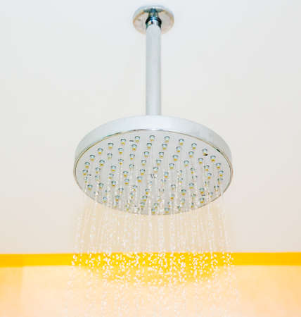Shower head with dropping waterの写真素材