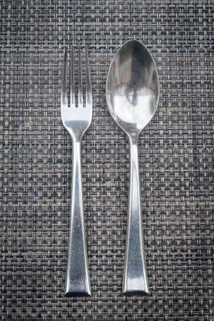 Fork and Spoon on matの写真素材