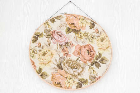 Vintage floral fabric on wooden backgroundの写真素材