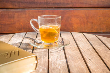 Cup of tea on a wooden backgroundの写真素材