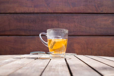 Cup of tea on a wooden backgroundの写真素材