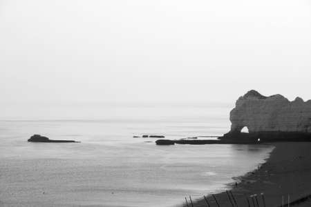 Etretat Aval cliff, rocks and natural arch landmark and blue ocean. Aerial view. Normandy, France, Europe.の写真素材
