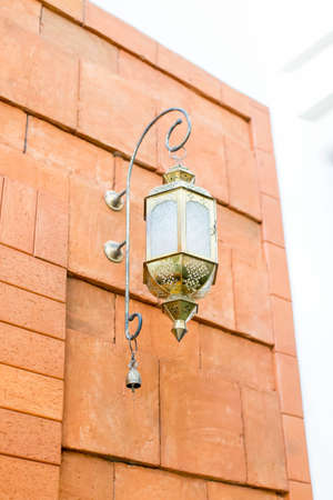 Morocco: Ornate metal lamp in the wallの写真素材