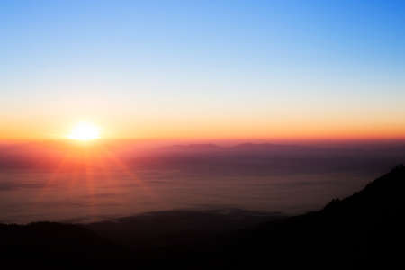 sun rise over a fog and mountain  in Thailandの写真素材